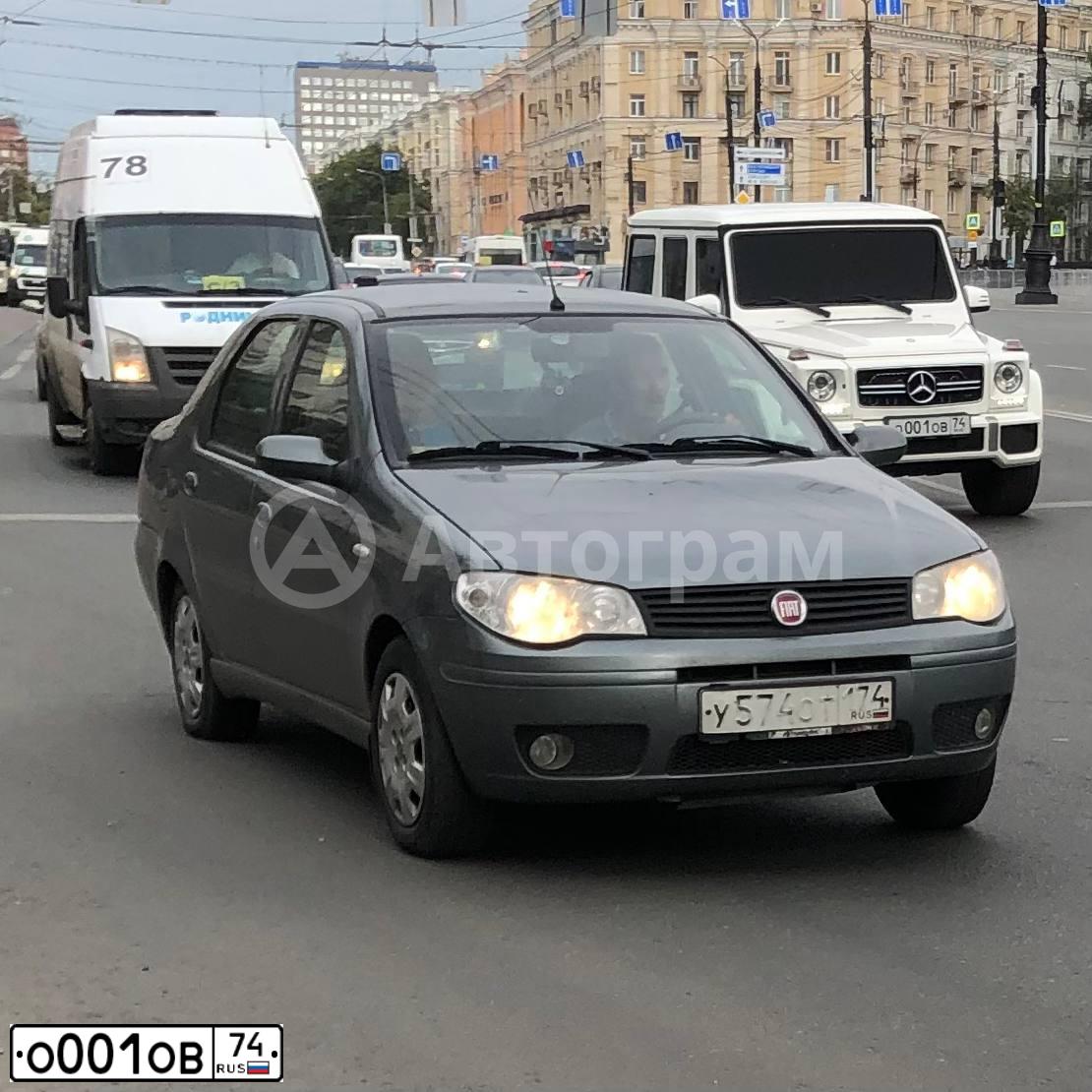 Фото автомобиля MITSUBISHI LANCER, 2013 — госномер О001ОВ74. Цвет: СЕРЫЙ