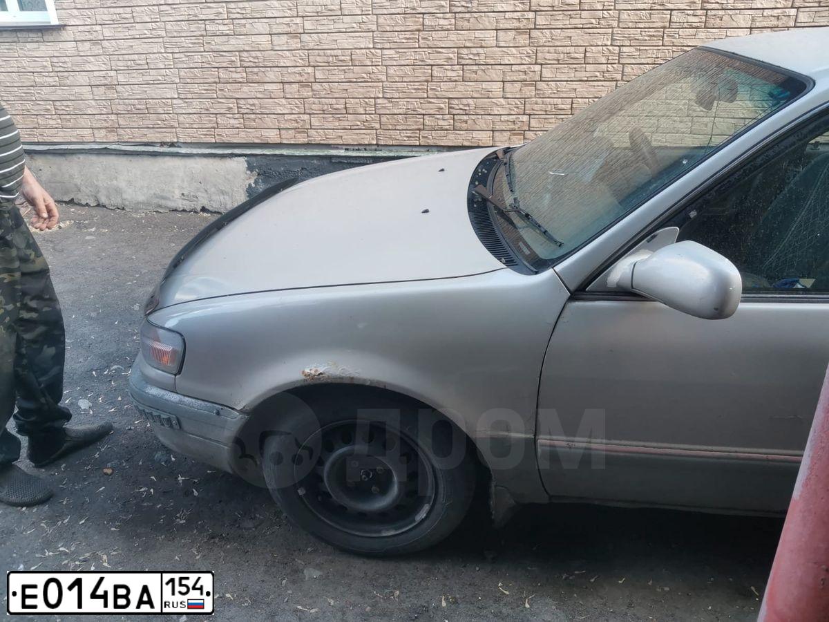 Фото автомобиля ТОЙОТАКОРОЛЛА ТОЙОТАКОРОЛЛА, 1995 — госномер Е014ВА154. Цвет: Серый