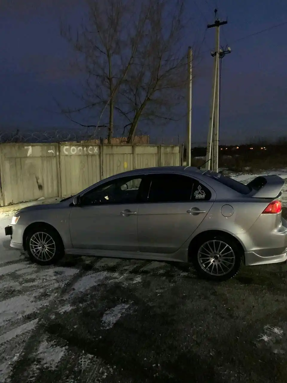 Фото автомобиля MITSUBISHI LANCER, 2008 — госномер А445ТТ77. Цвет: Серебристый