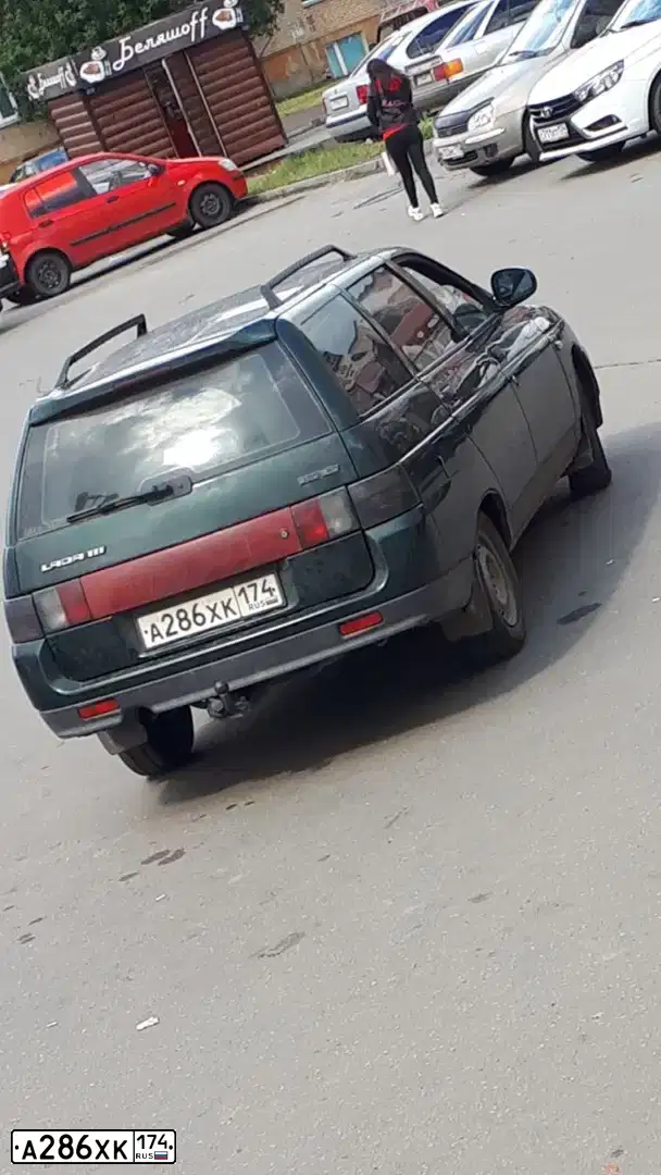 Фото автомобиля LADA 2111, 2003 — госномер А286ХК174. Цвет: Темно-зеленый