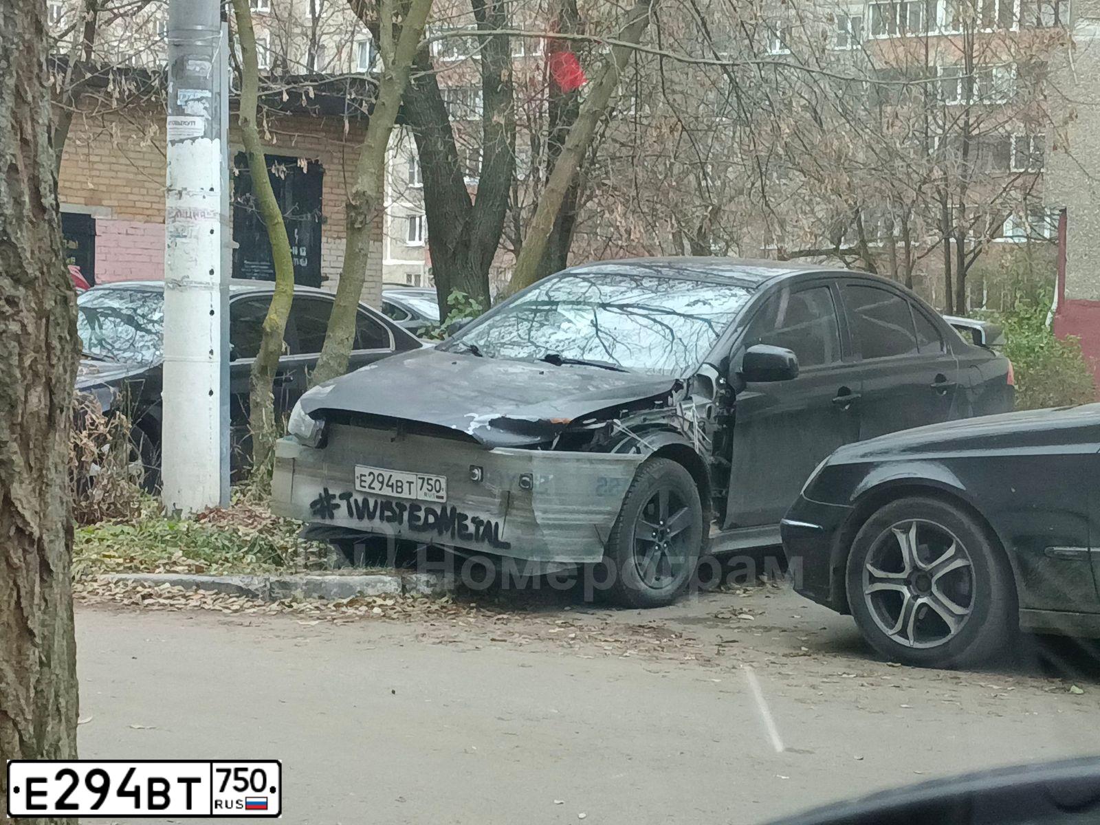 Фото автомобиля MITSUBISHI LANCER, 2008 — госномер Е294ВТ750. Цвет: ЧЕРНЫЙ