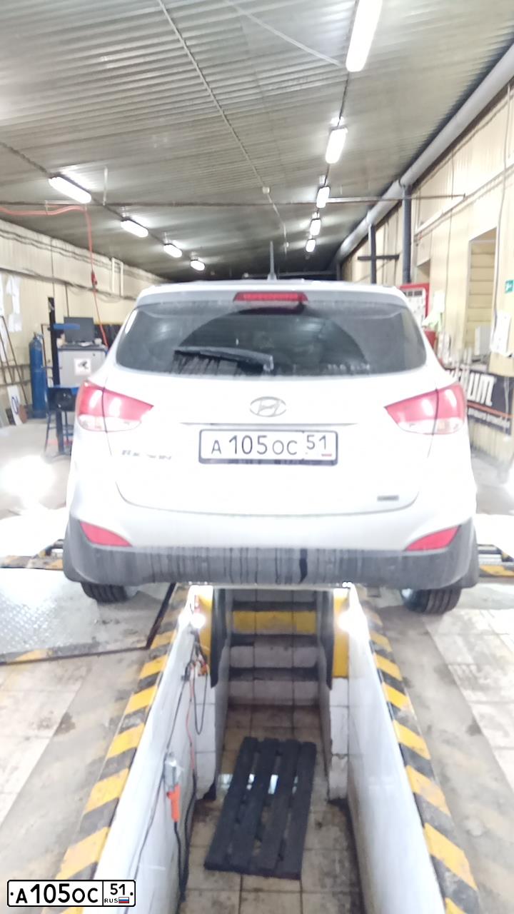 Фото автомобиля HYUNDAI TUCSON, 2011 — госномер А105ОС51. Цвет: Серый