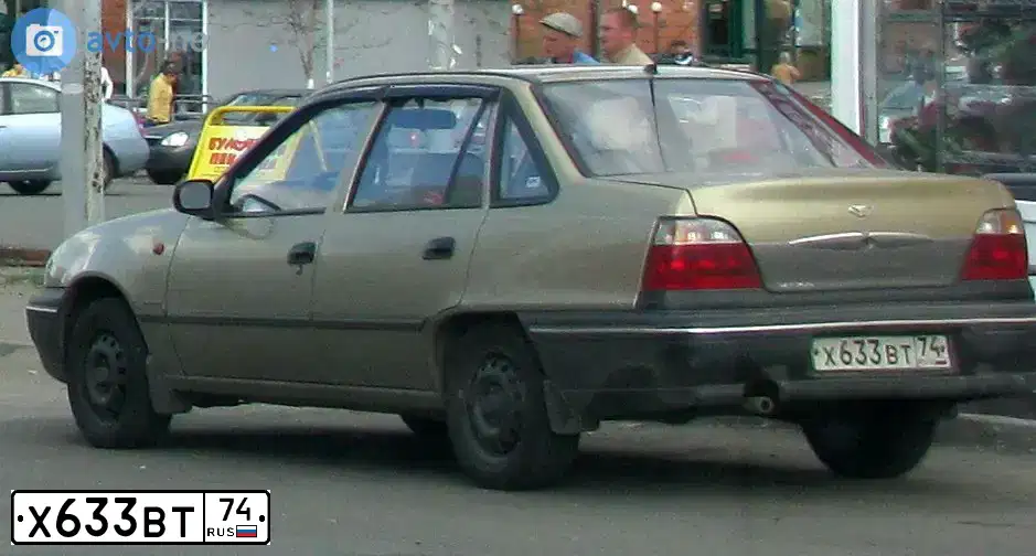 Фото автомобиля DAEWOO NEXIA, 2008 — госномер М221ЕР174. Цвет: ЧЕРНО-СИНИЙ