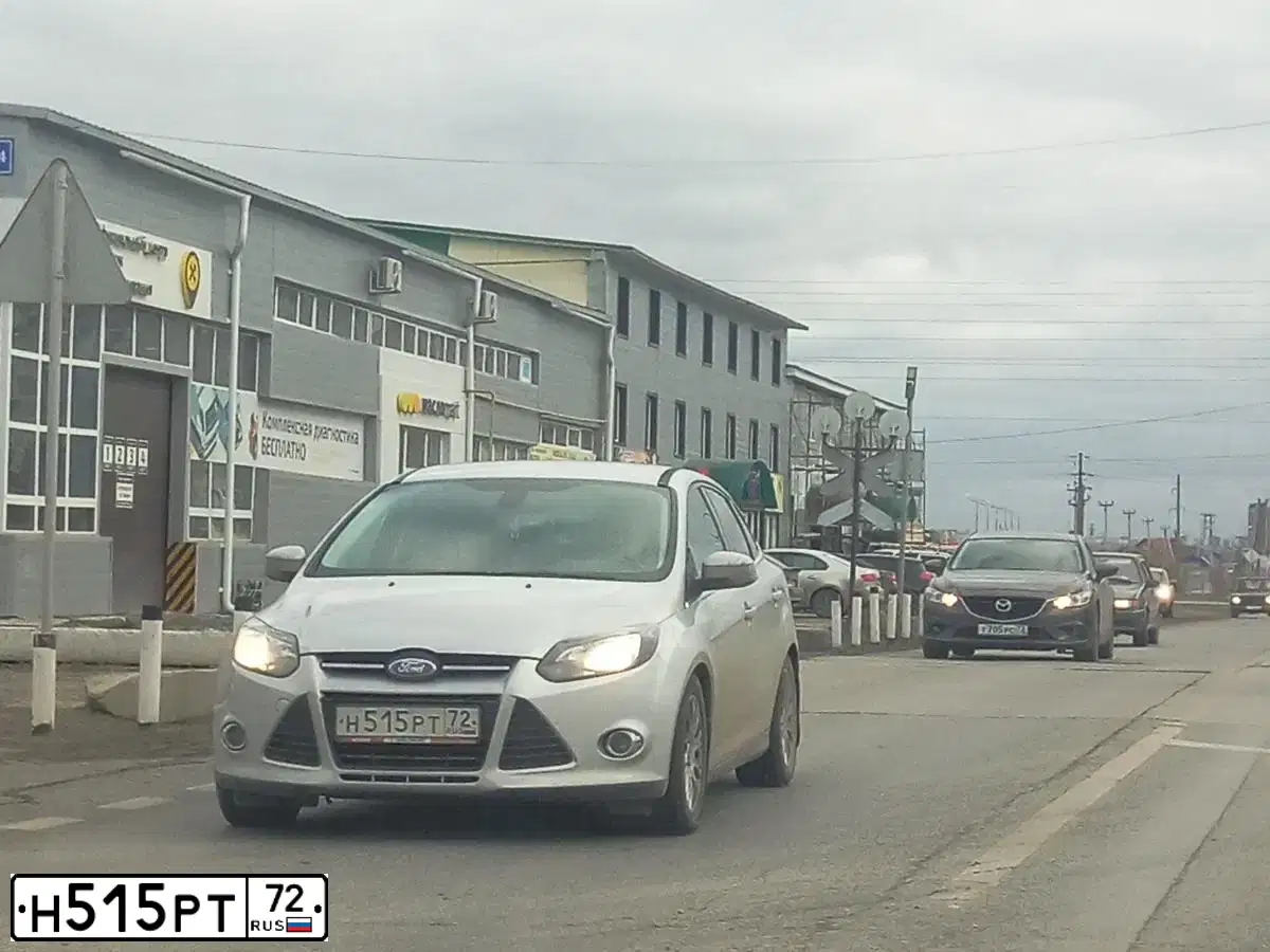 Фото автомобиля FORD FOCUS, 2011 — госномер Н515РТ72. Цвет: СЕРЕБРИСТЫЙ