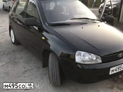 Фото автомобиля LADA 1117 KALINA, 2010 — госномер Р765СО36. Цвет: ЧЕРНЫЙ