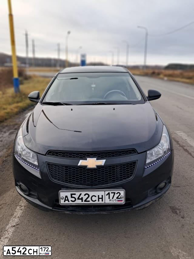 Фото автомобиля CHEVROLET CRUZE, 2010 — госномер Е928ОЕ45. Цвет: ЧЕРНЫЙ