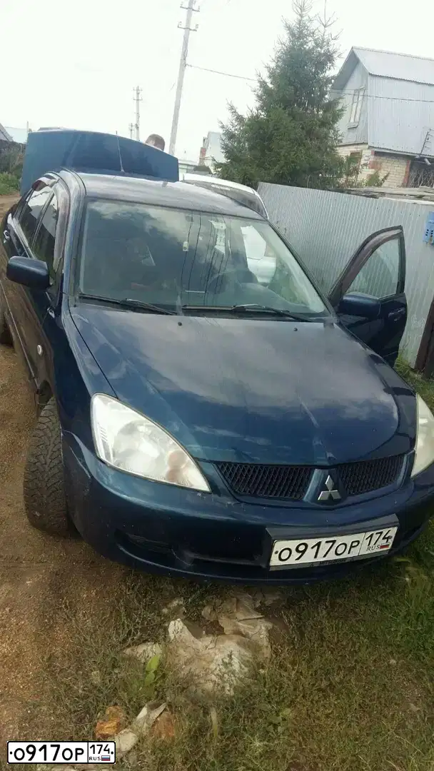 Фото автомобиля MITSUBISHI LANCER, 2007 — госномер Р267АВ774. Цвет: синий