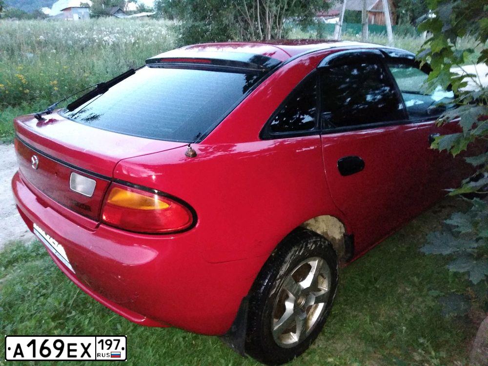 Фото автомобиля MAZDA 323, 1997 — госномер А169ЕХ197. Цвет: КРАСНЫЙ