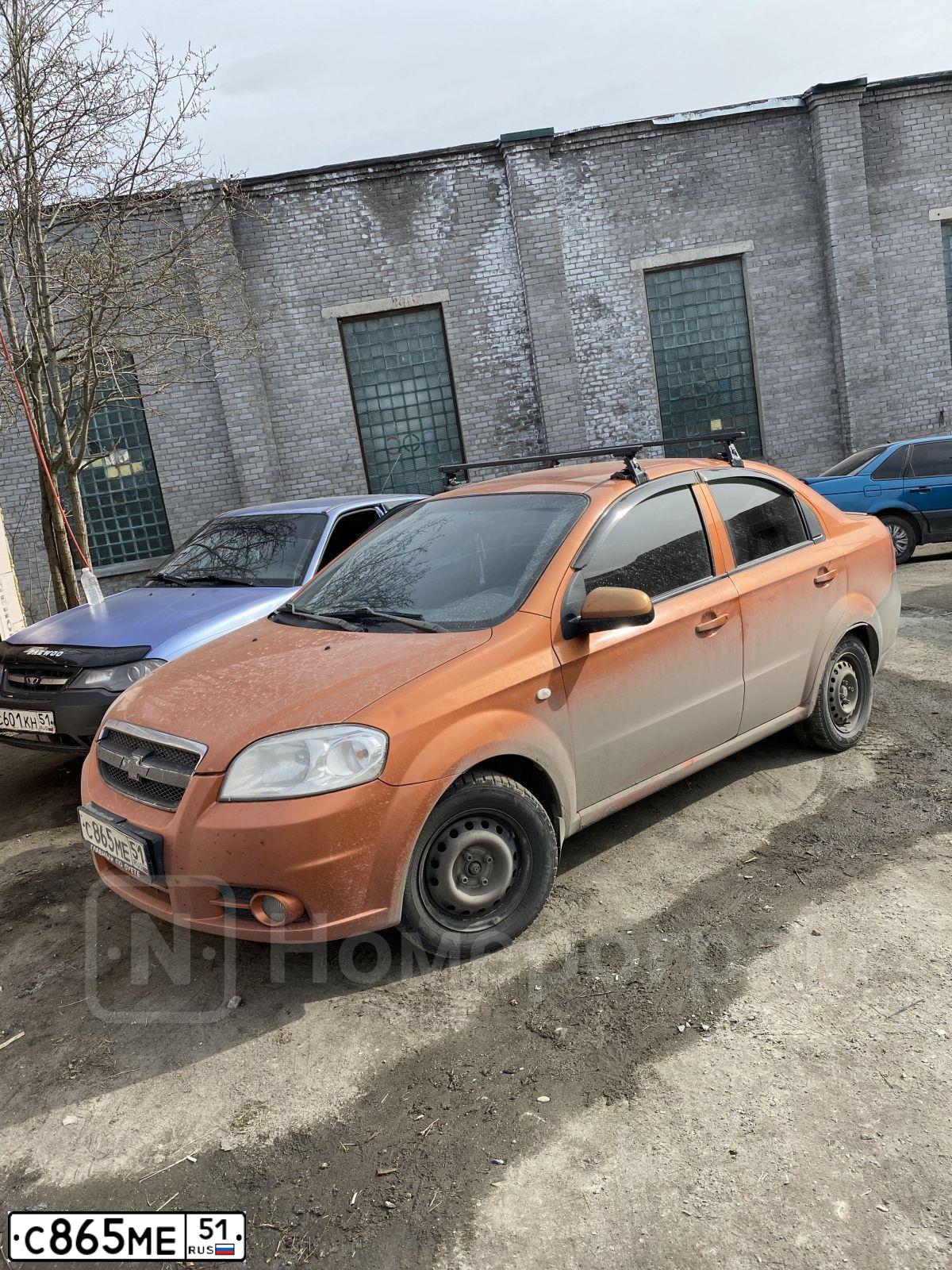 Фото автомобиля CHEVROLET AVEO, 2006 — госномер С865МЕ51. Цвет: Оранжевый