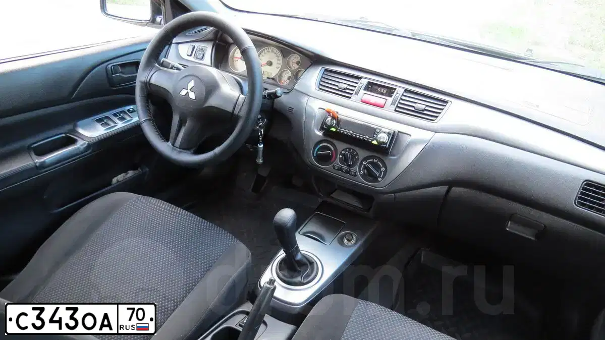 Фото автомобиля MITSUBISHI LANCER, 2006 — госномер С343ОА70. Цвет: ЧЕРНЫЙ
