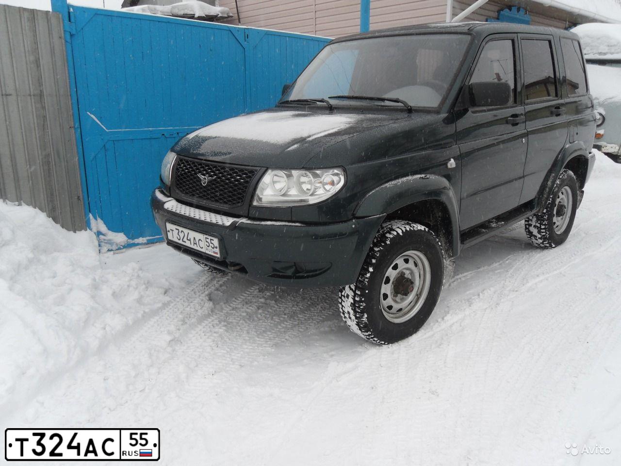 Фото автомобиля UAZ 3164 PATRIOT, 2010 — госномер Т324АС55. Цвет: Т.ЗЕЛЕНЫЙ
