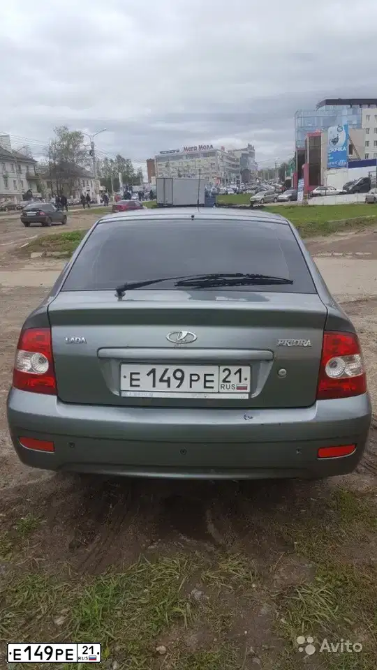 Фото автомобиля LADA 2172 PRIORA, 2009 — госномер Е149РЕ21. Цвет: СРЕДНИЙ СЕРО-ЗЕЛЕНЫЙ МЕТ.