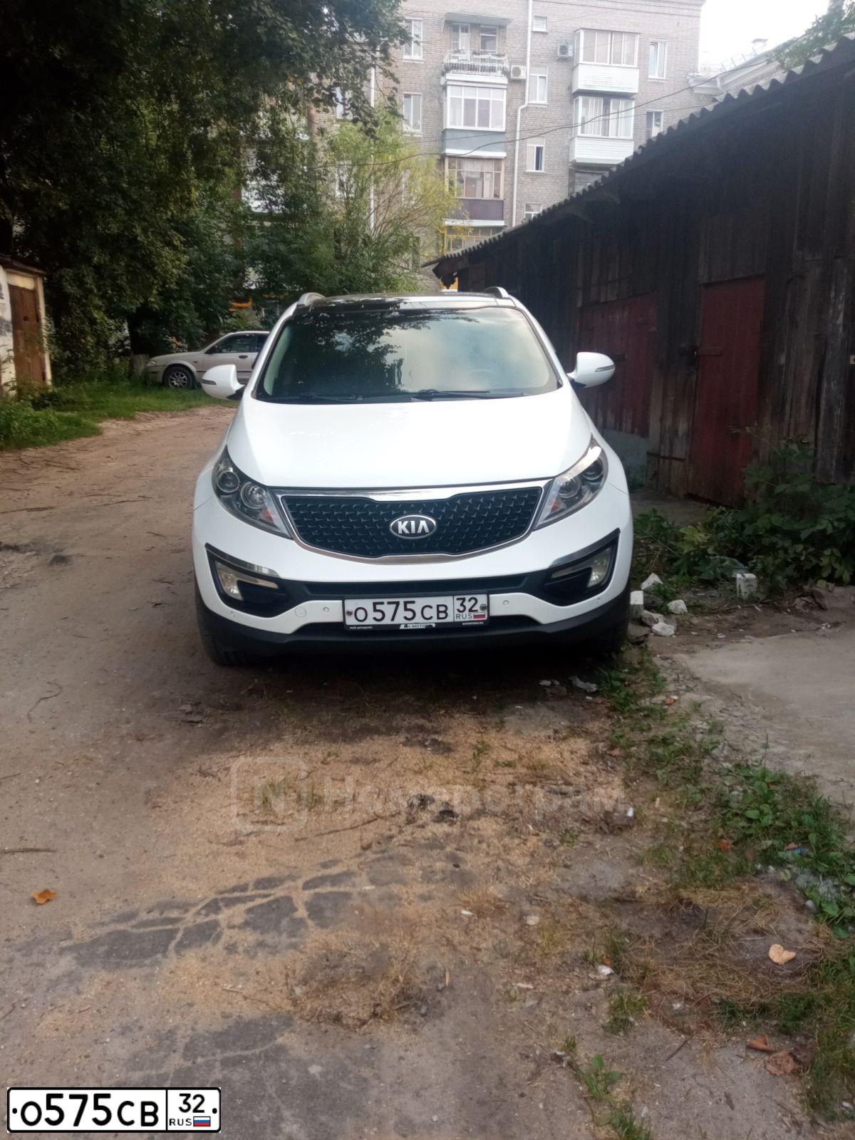 Фото автомобиля KIA SPORTAGE, 2013 — госномер О575СВ32. Цвет: Белый