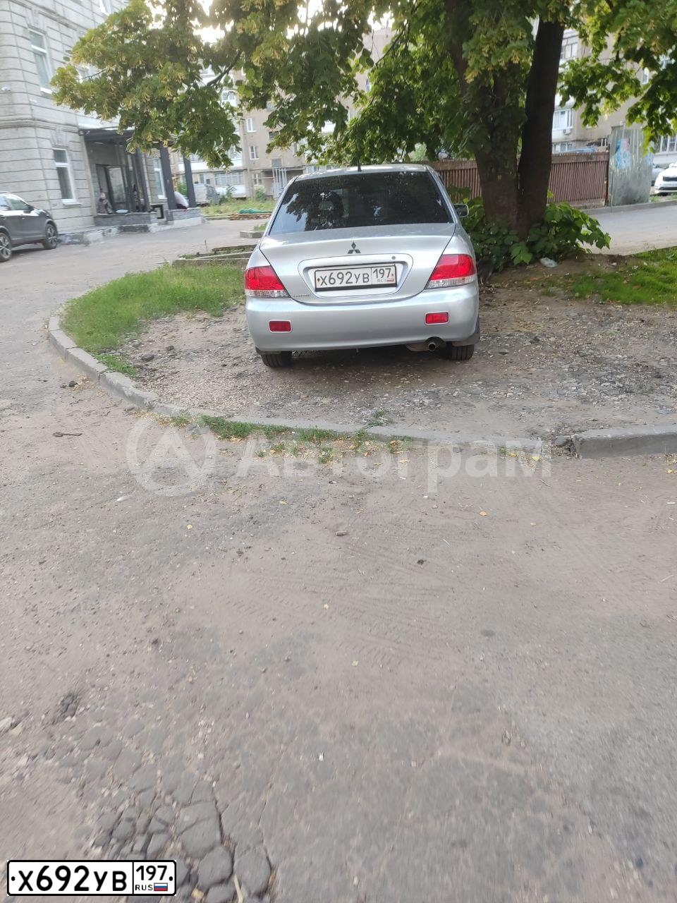 Фото автомобиля MITSUBISHI LANCER, 2004 — госномер К969ТТ97. Цвет: Серебристый