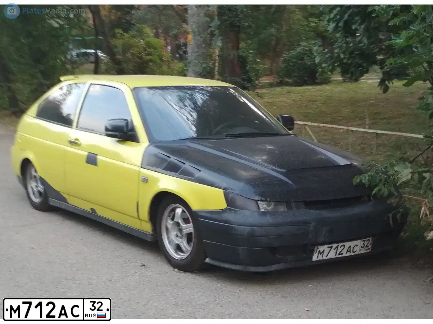 Фото автомобиля LADA 2112, 2007 — госномер М712АС32. Цвет: ЖЁЛТЫЙ