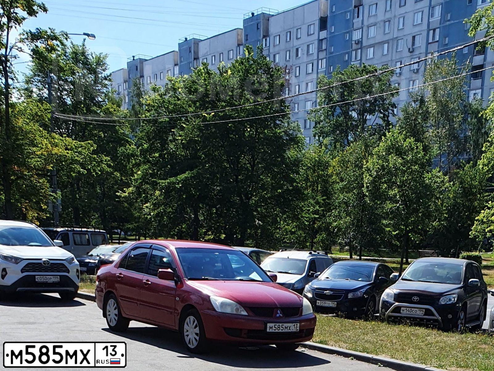 Фото автомобиля MITSUBISHI LANCER, 2006 — госномер М585МХ13. Цвет: Красный