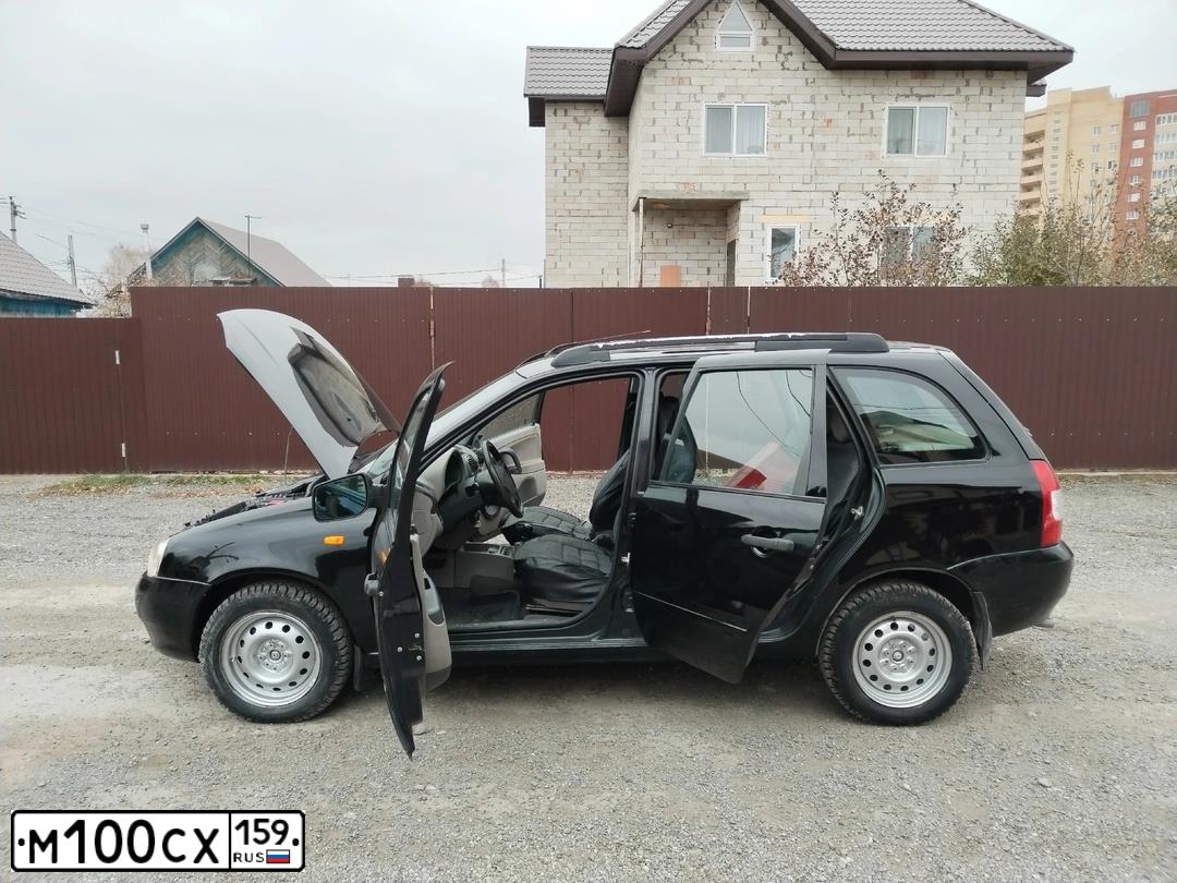Фото автомобиля LADA 1117 KALINA, 2011 — госномер М100СХ159. Цвет: СИНЕ-ЧЕРНЫЙ