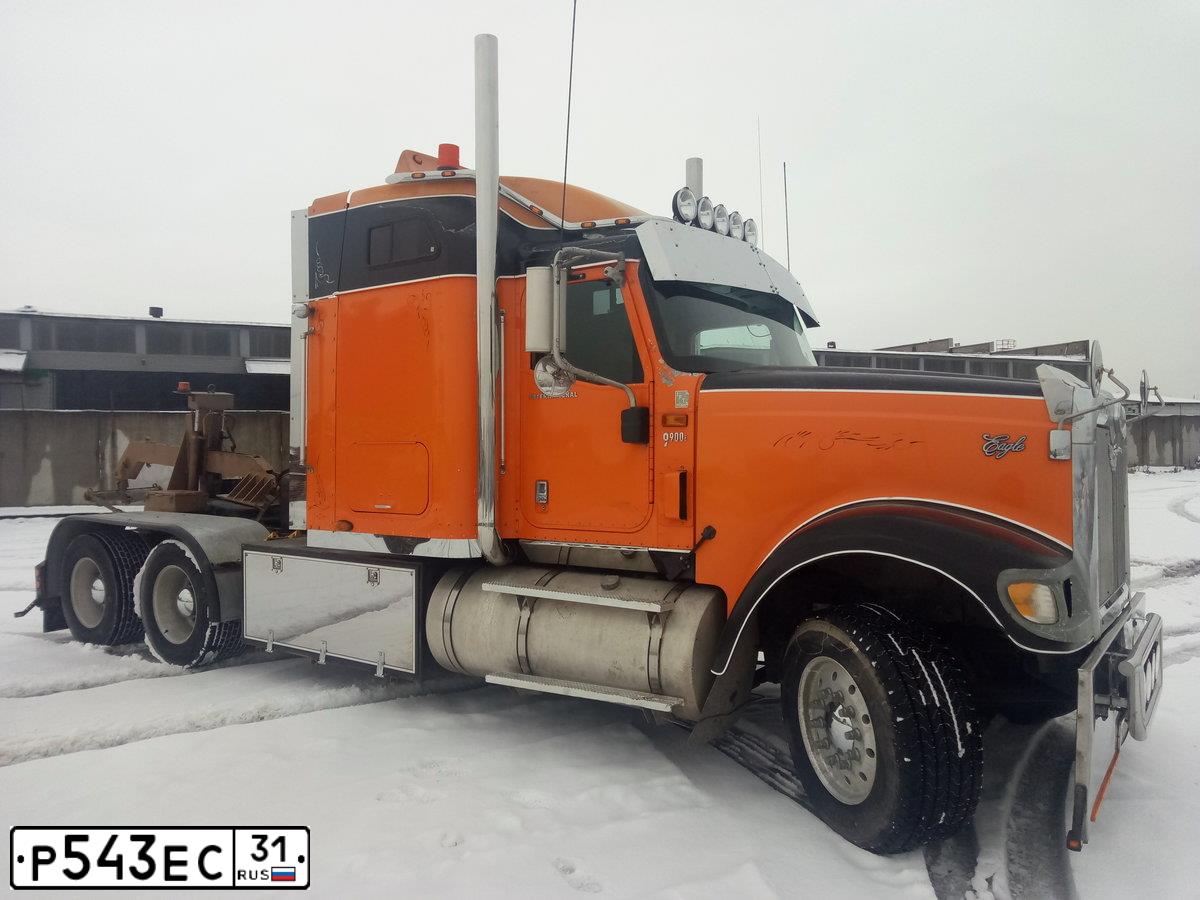 Фото автомобиля INTERNATIONAL HEAVY TRUCK 8500-9900, 2003 — госномер К577ОТ95. Цвет: Оранжевый