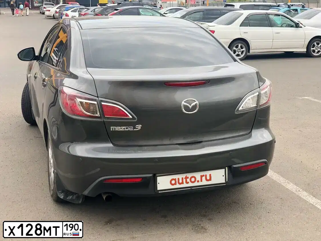 Фото автомобиля MAZDA 3, 2010 — госномер Н228ОО124. Цвет: СЕРЫЙ ТЕМНЫЙ