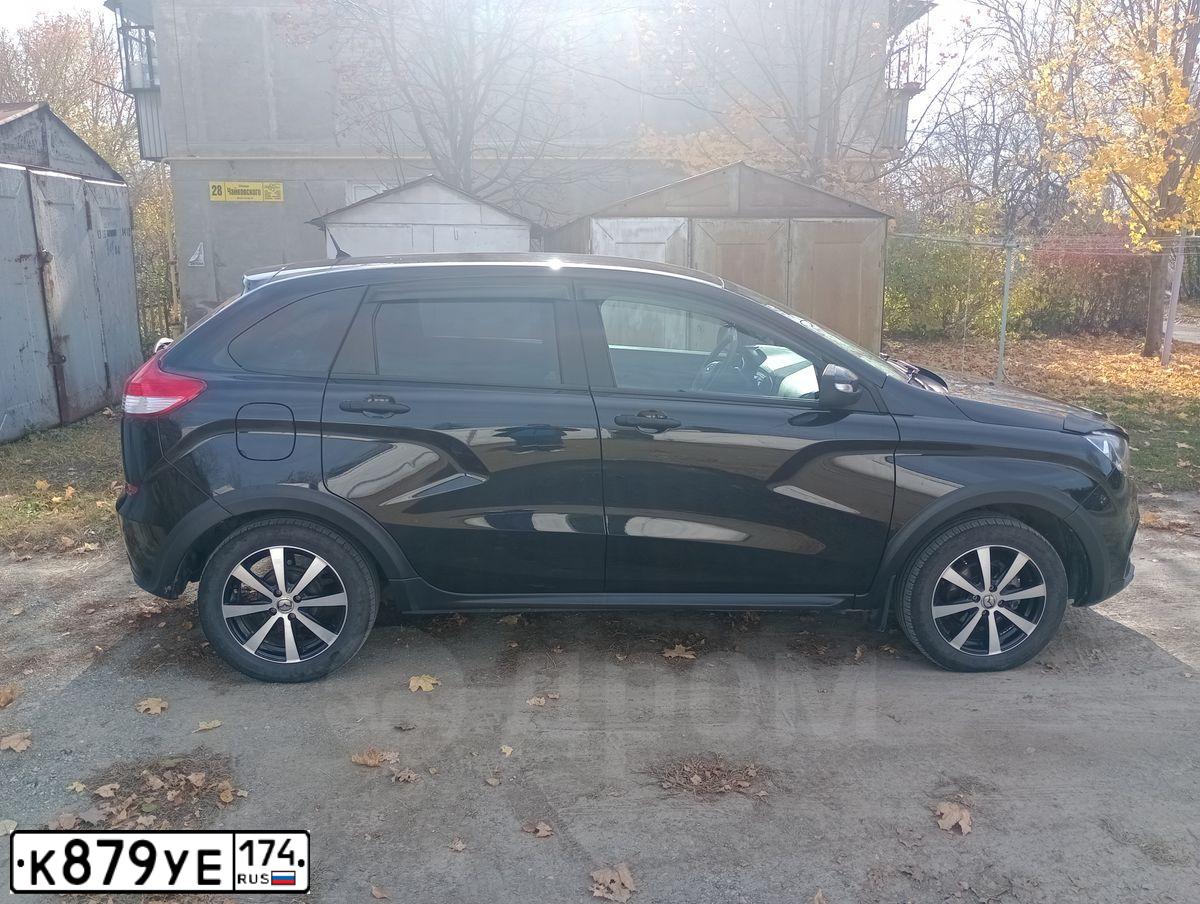 Фото автомобиля LADA XRAY, 2019 — госномер К879УЕ174. Цвет: ЧЕРНЫЙ