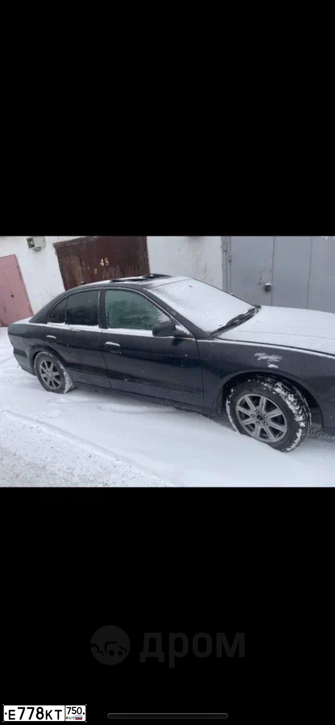 Фото автомобиля MITSUBISHI GALANT, 1998 — госномер Е778КТ750. Цвет: ЧЕРНЫЙ