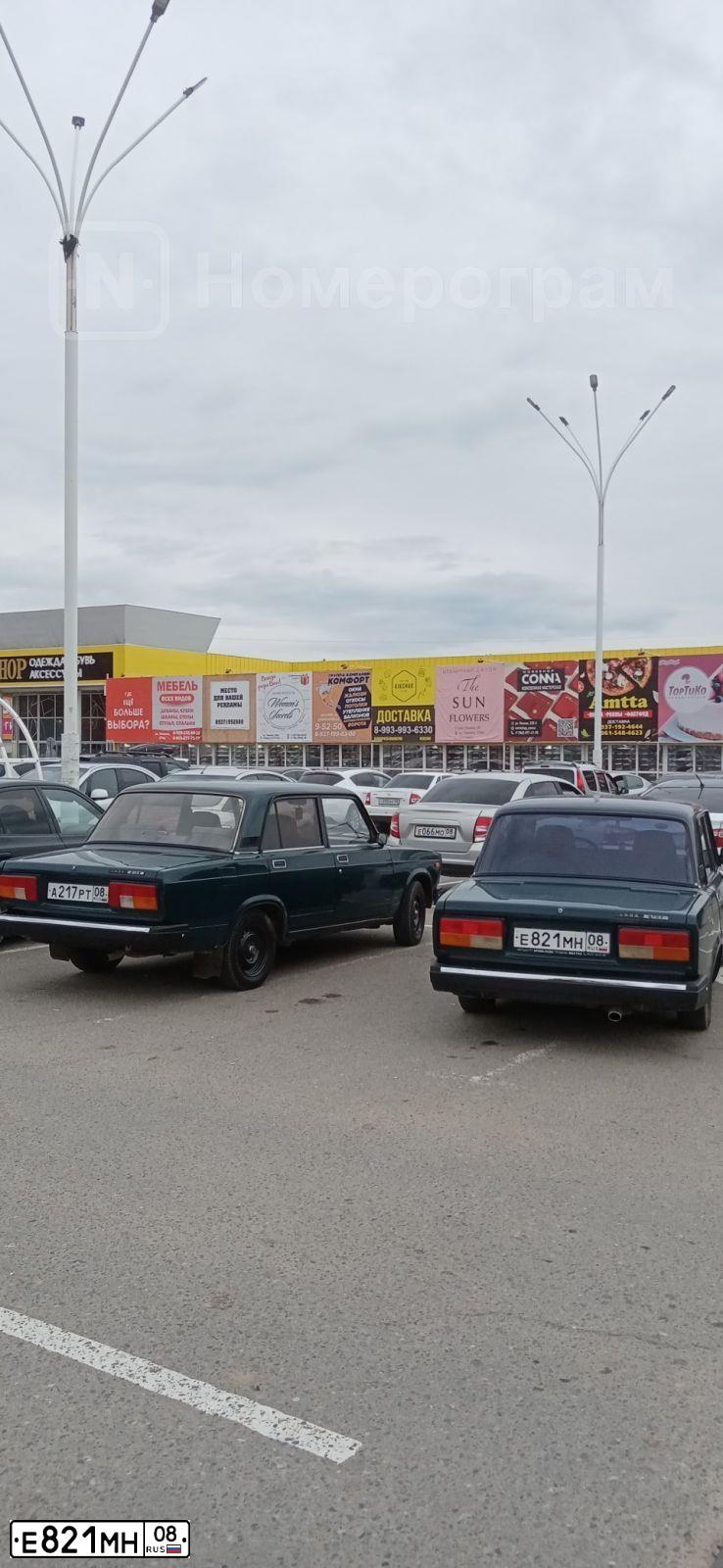 Фото автомобиля LADA 2107, 2008 — госномер Е821МН08. Цвет: Темно-зеленый