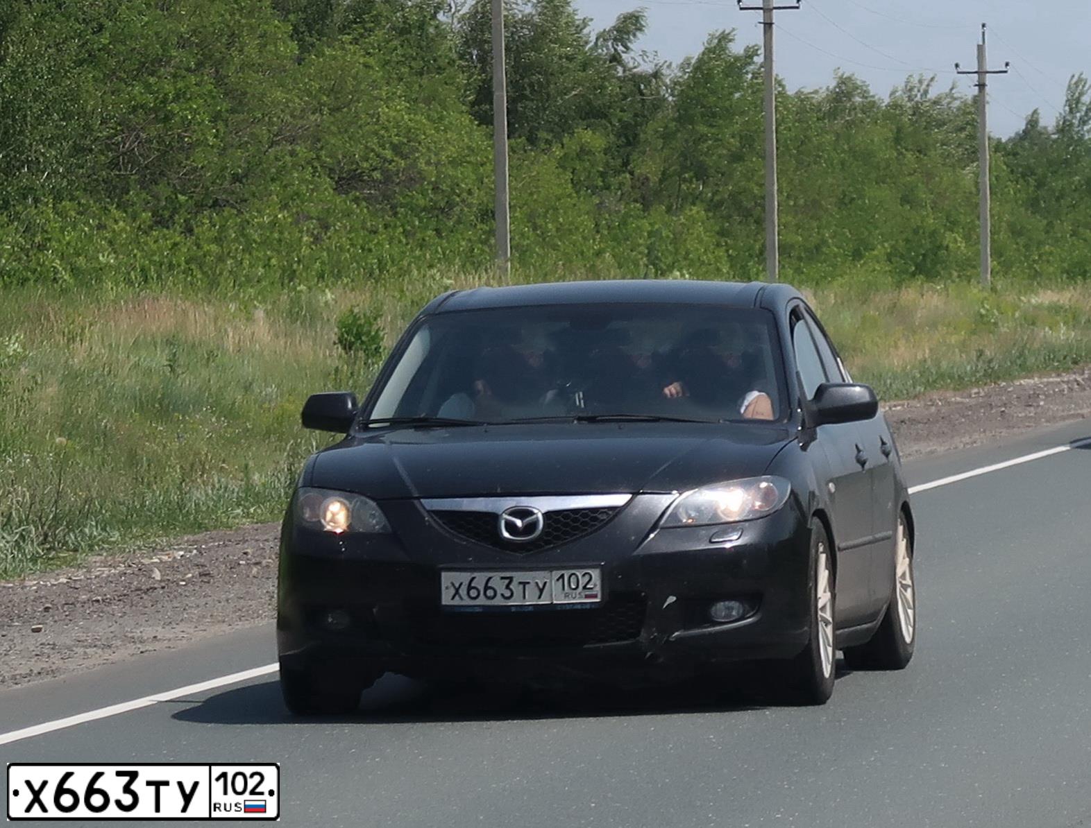 Фото автомобиля MAZDA 3, 2008 — госномер М085ТС702. Цвет: ЧЕРНЫЙ