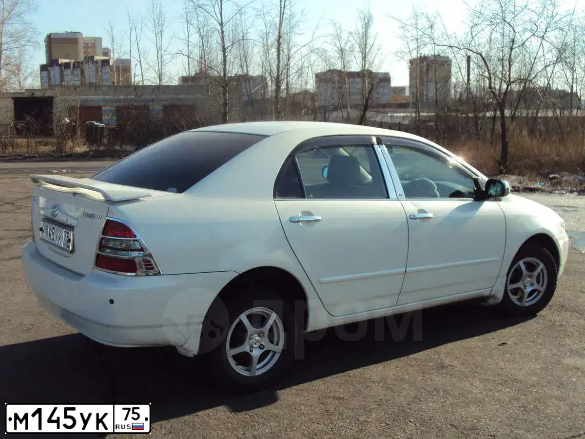 Фото автомобиля TOYOTA COROLLA, 2010 — госномер К501УМ38. Цвет: Темно-синий