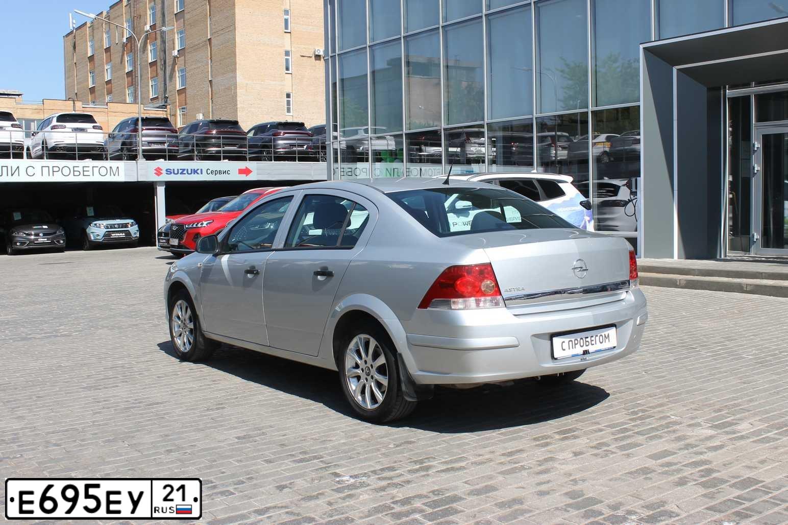 Фото автомобиля OPEL ASTRA, 2012 — госномер Е695ЕУ21. Цвет: СЕРЫЙ