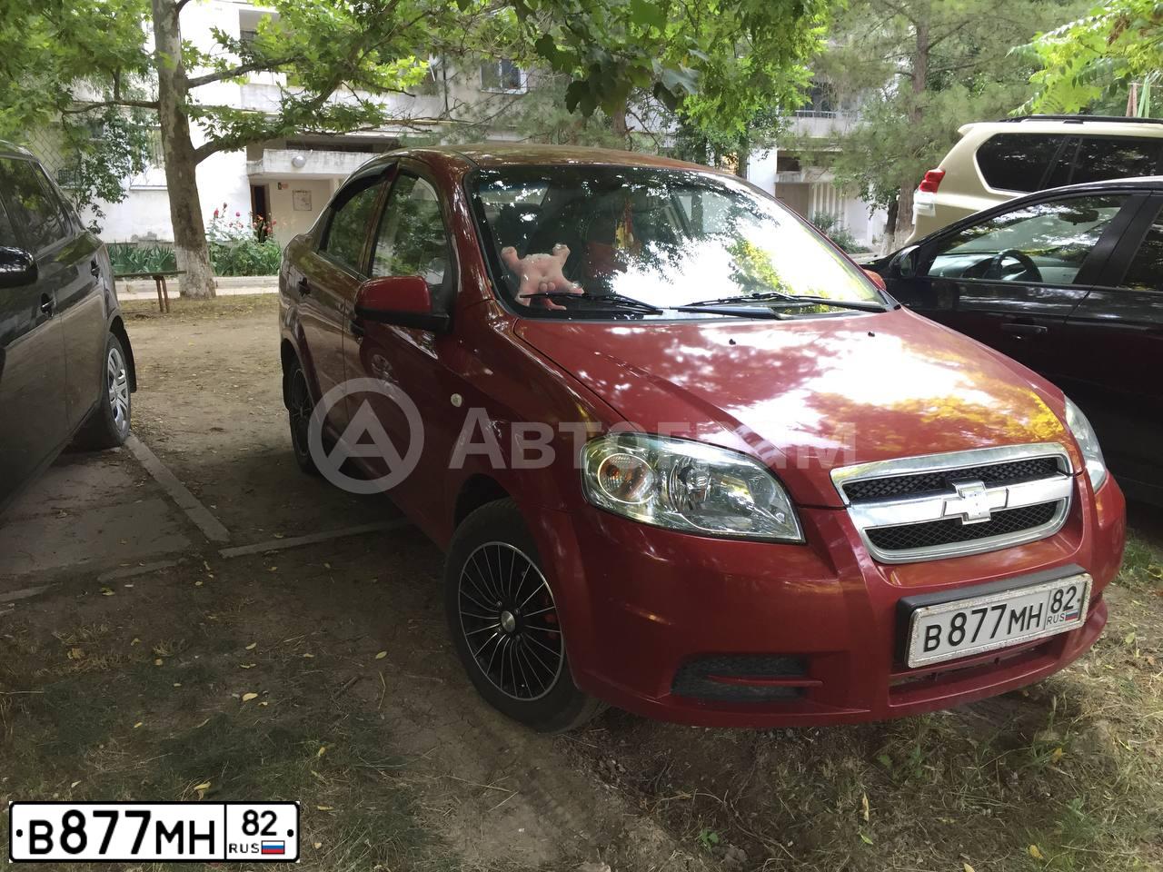 Фото автомобиля CHEVROLET AVEO, 2011 — госномер В877МН82. Цвет: Красный