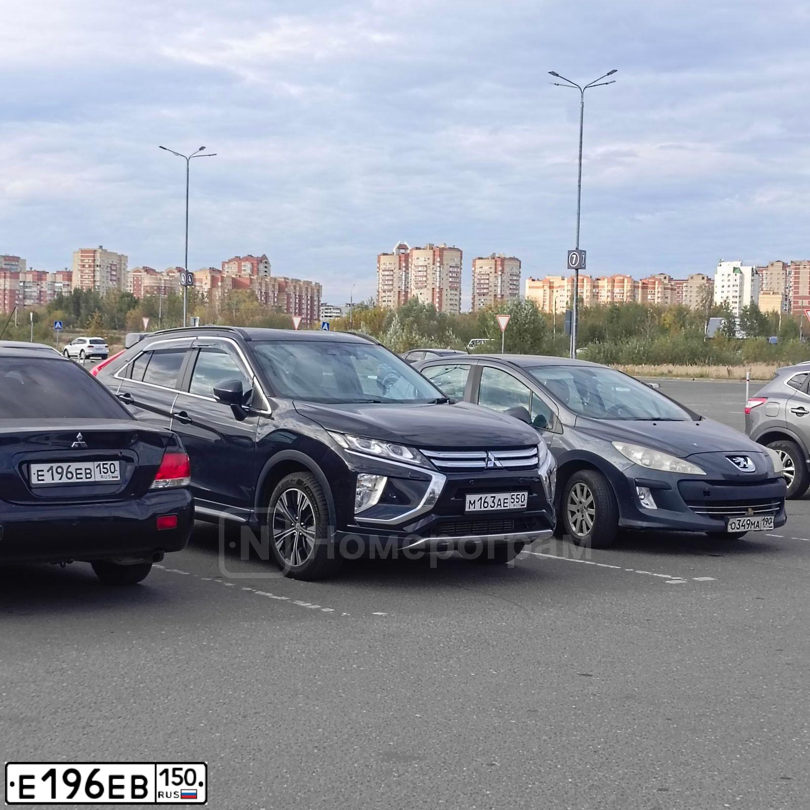 Фото автомобиля MITSUBISHI LANCER, 2006 — госномер Е196ЕВ150. Цвет: ЧЕРНЫЙ