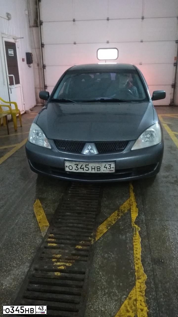 Фото автомобиля MITSUBISHI LANCER, 2006 — госномер О345НВ43. Цвет: СЕРЫЙ