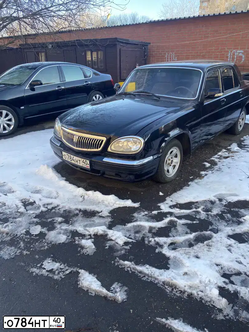 Фото автомобиля GAZ 3110 WOLGA, 2006 — госномер Е965АМ790. Цвет: ЧЕРНЫЙ