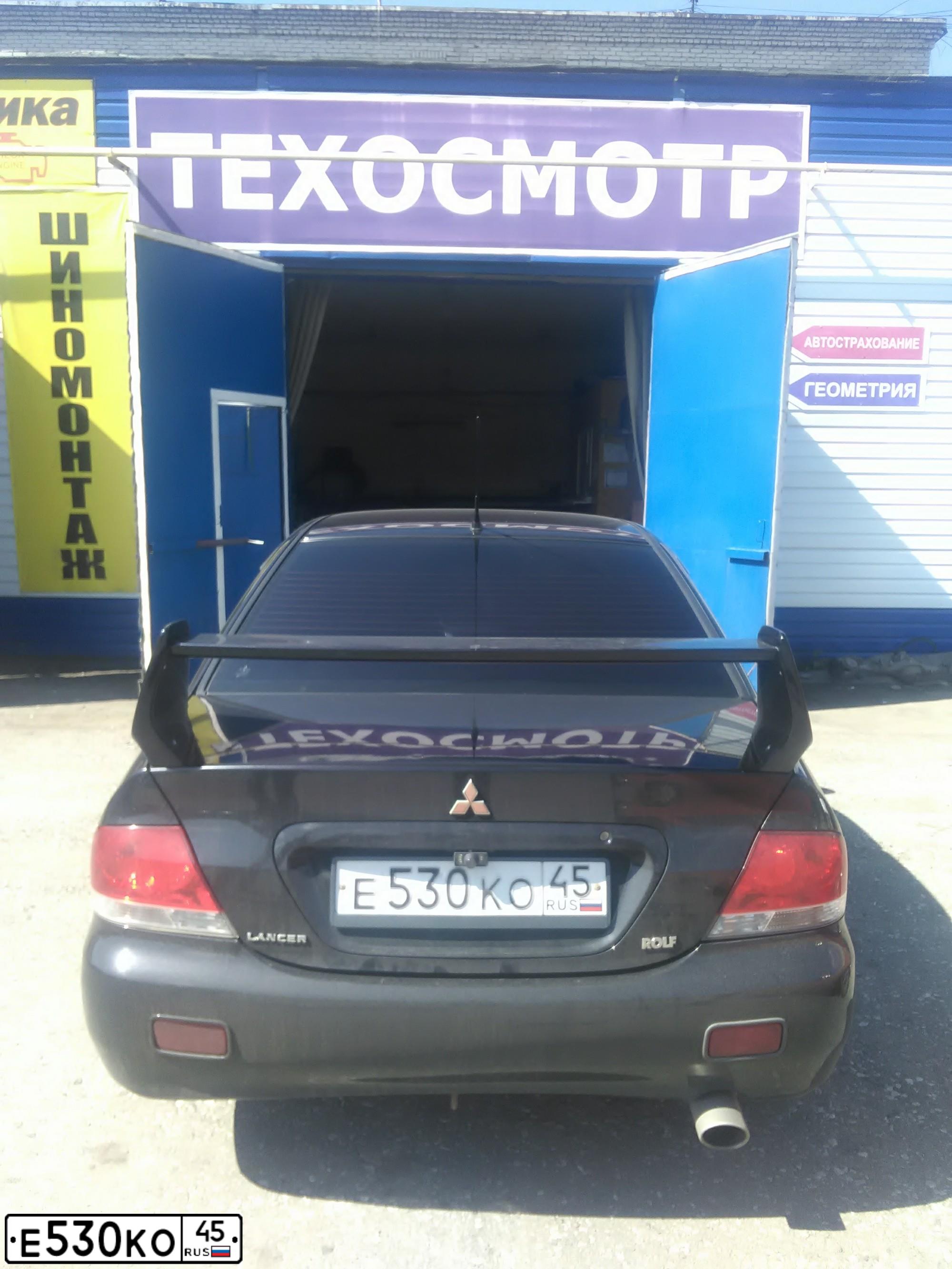 Фото автомобиля MITSUBISHI LANCER, 2007 — госномер Е530КО45. Цвет: ЧЕРНЫЙ