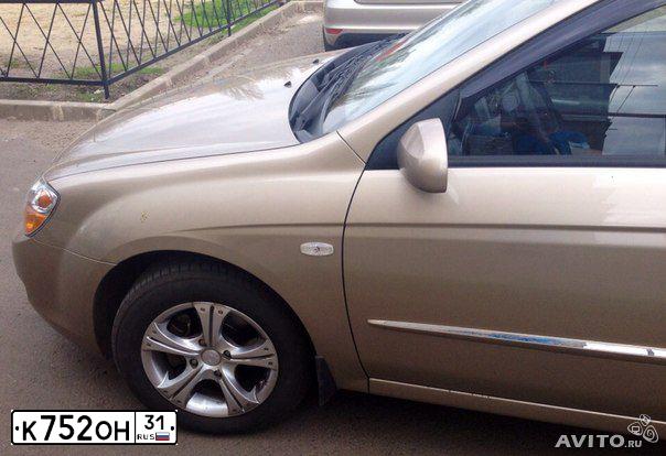 Фото автомобиля KIA CERATO, 2007 — госномер К752ОН31. Цвет: ЗОЛОТИСТЫЙ