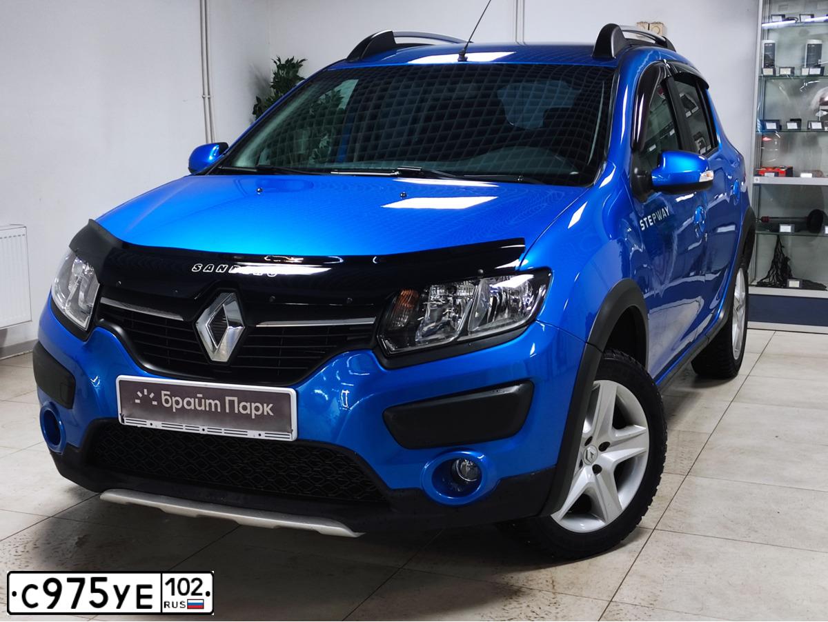 Фото автомобиля RENAULT SANDERO, 2016 — госномер С975УЕ102. Цвет: светло-синий