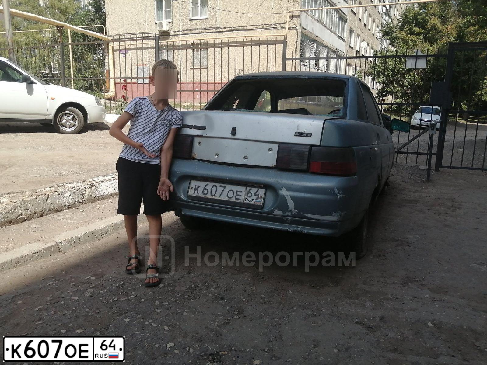 Фото автомобиля LADA 2112, 2004 — госномер У777ОР64. Цвет: ЧЕРНЫЙ
