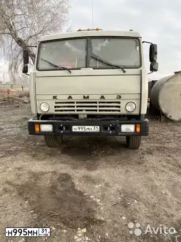 Фото автомобиля KAMAZ 55111 /6X4/, 1999 — госномер Н995МН31. Цвет: СВЕТЛО-ДЫМЧАТЫЙ