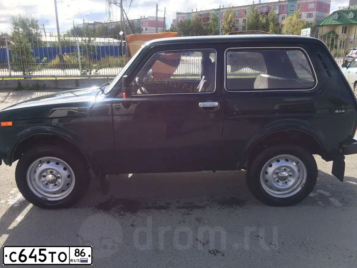 Фото автомобиля LADA 2121 NIVA, 2009 — госномер С645ТО86. Цвет: ТЕМНО-ЗЕЛЕНЫЙ