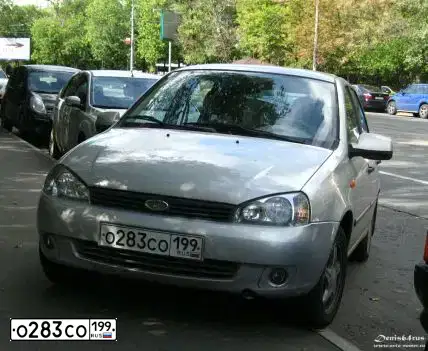 Фото автомобиля LADA KALINA, 2009 — госномер Р942МН136. Цвет: Серый