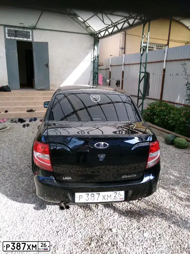 Фото автомобиля LADA 2190 GRANTA, 2013 — госномер А002КО07. Цвет: Сине-Черный