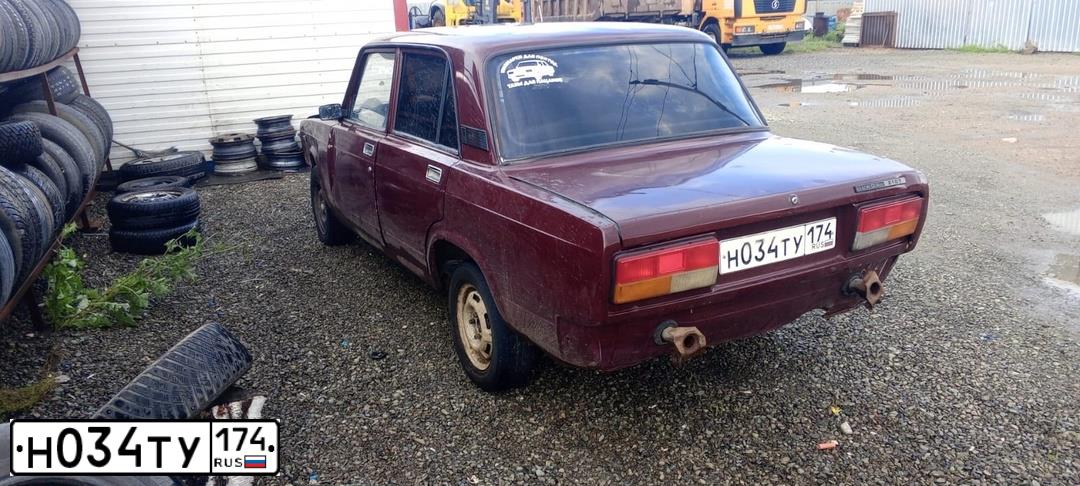 Фото автомобиля LADA 2107, 2006 — госномер Н034ТУ174. Цвет: ТЕМНО-ВИШНЕВЫЙ