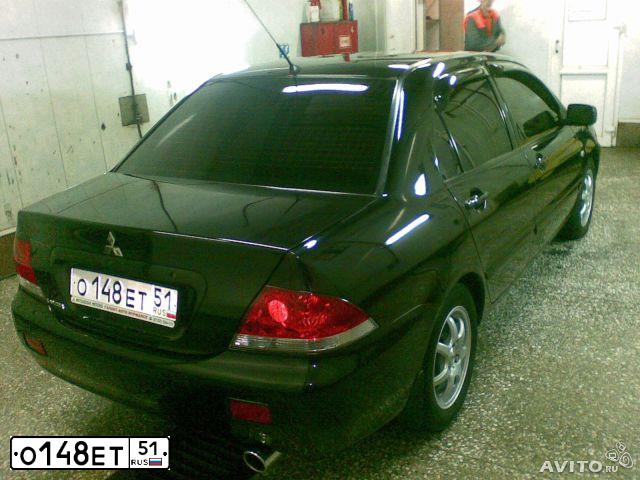 Фото автомобиля MITSUBISHI LANCER, 2007 — госномер О148ЕТ51. Цвет: ЧЕРНЫЙ