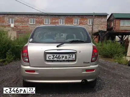 Фото автомобиля TOYOTA DUET, 2001 — госномер С346РА27