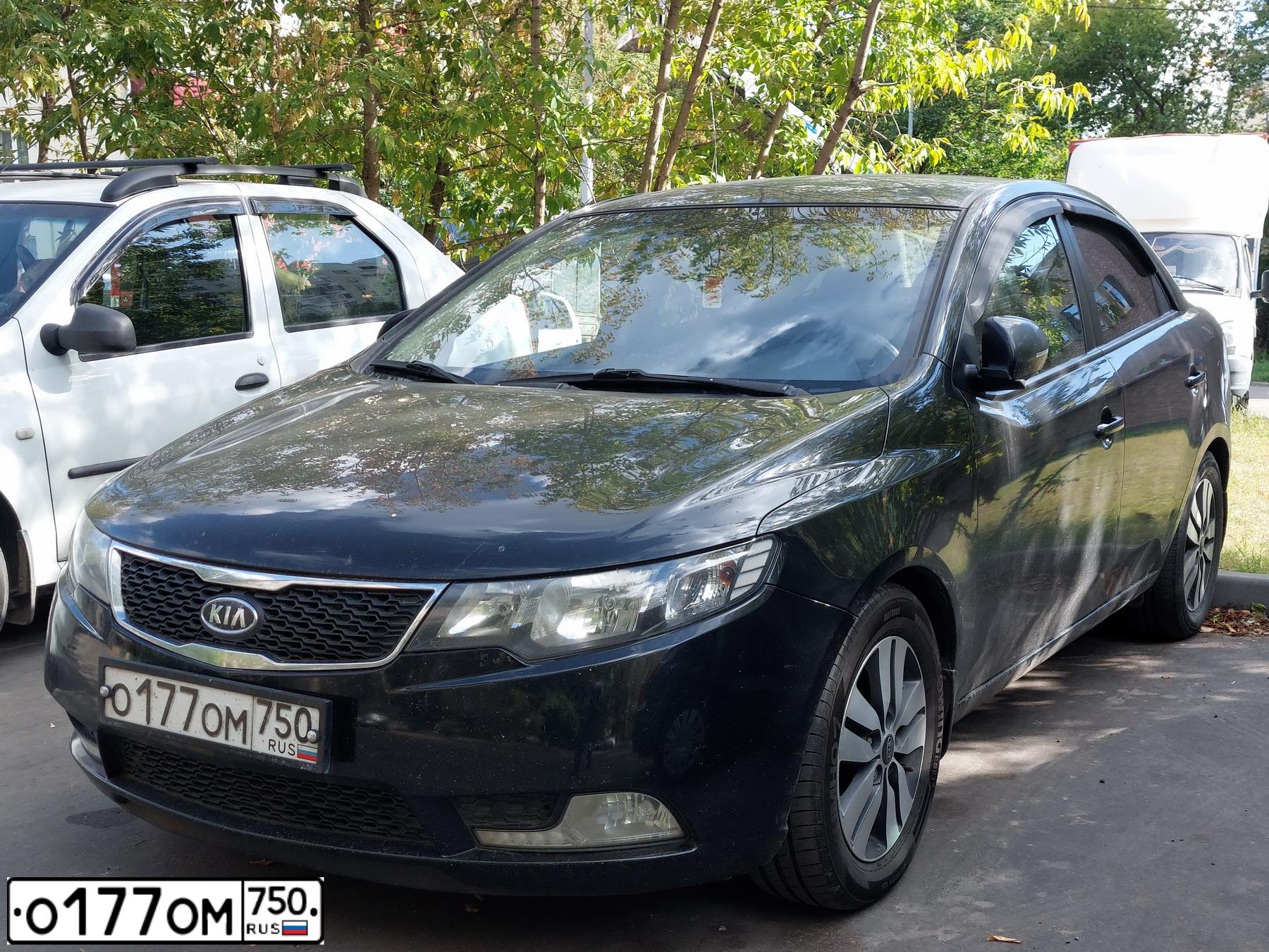 Фото автомобиля KIA CERATO, 2012 — госномер О177ОМ750. Цвет: ЧЕРНЫЙ