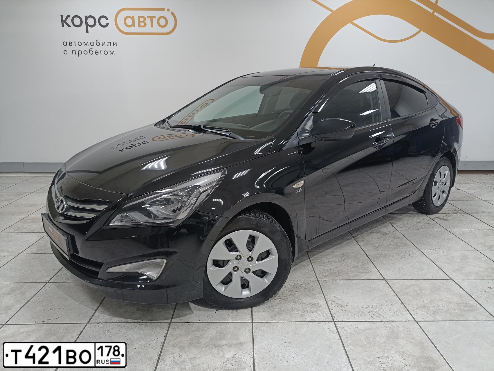 Фото автомобиля HYUNDAI SOLARIS, 2015 — госномер Х095КК31. Цвет: ЧЕРНЫЙ