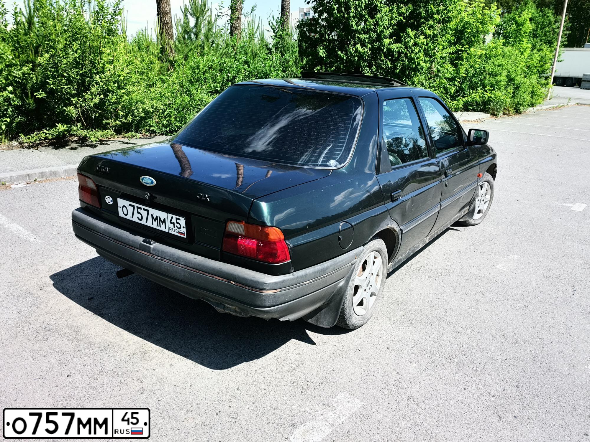 Фото автомобиля FORD ORION, 1993 — госномер О757ММ45. Цвет: Темно-зеленый