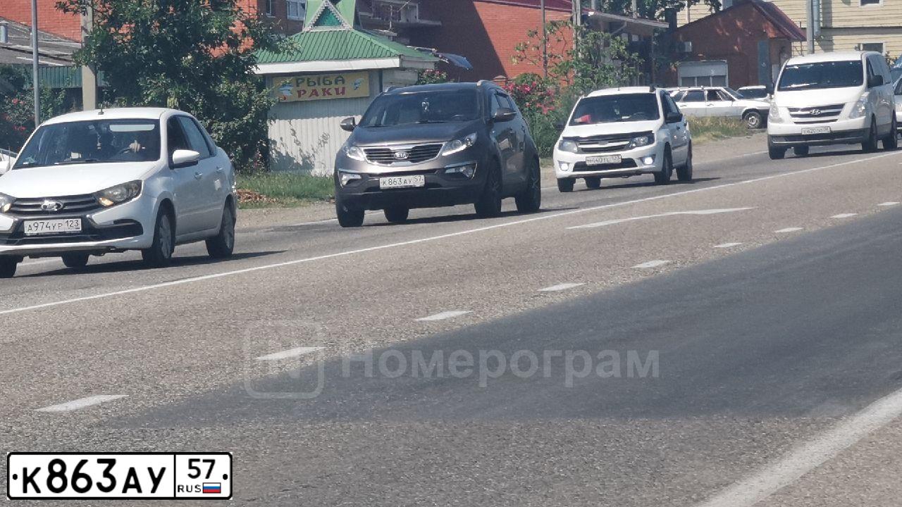 Фото автомобиля KIA SPORTAGE, 2012 — госномер К863АУ57. Цвет: Коричневый