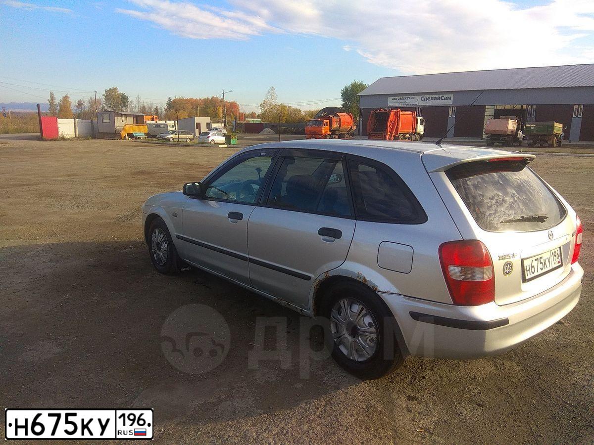 Фото автомобиля MAZDA 323, 1999 — госномер М002АО196. Цвет: СВЕТЛО СЕРЫЙ