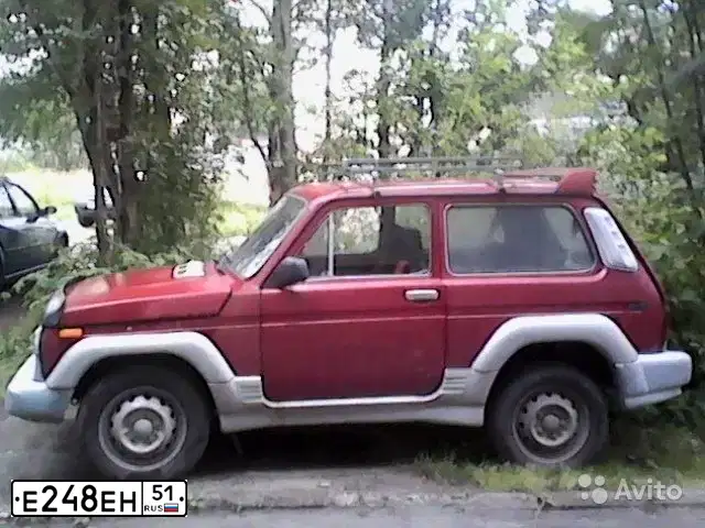 Фото автомобиля LADA 2121 NIVA, 1996 — госномер Е248ЕН51. Цвет: ВИШНЕВЫЙ